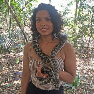 Jennifer Coronel poses holding a snake.